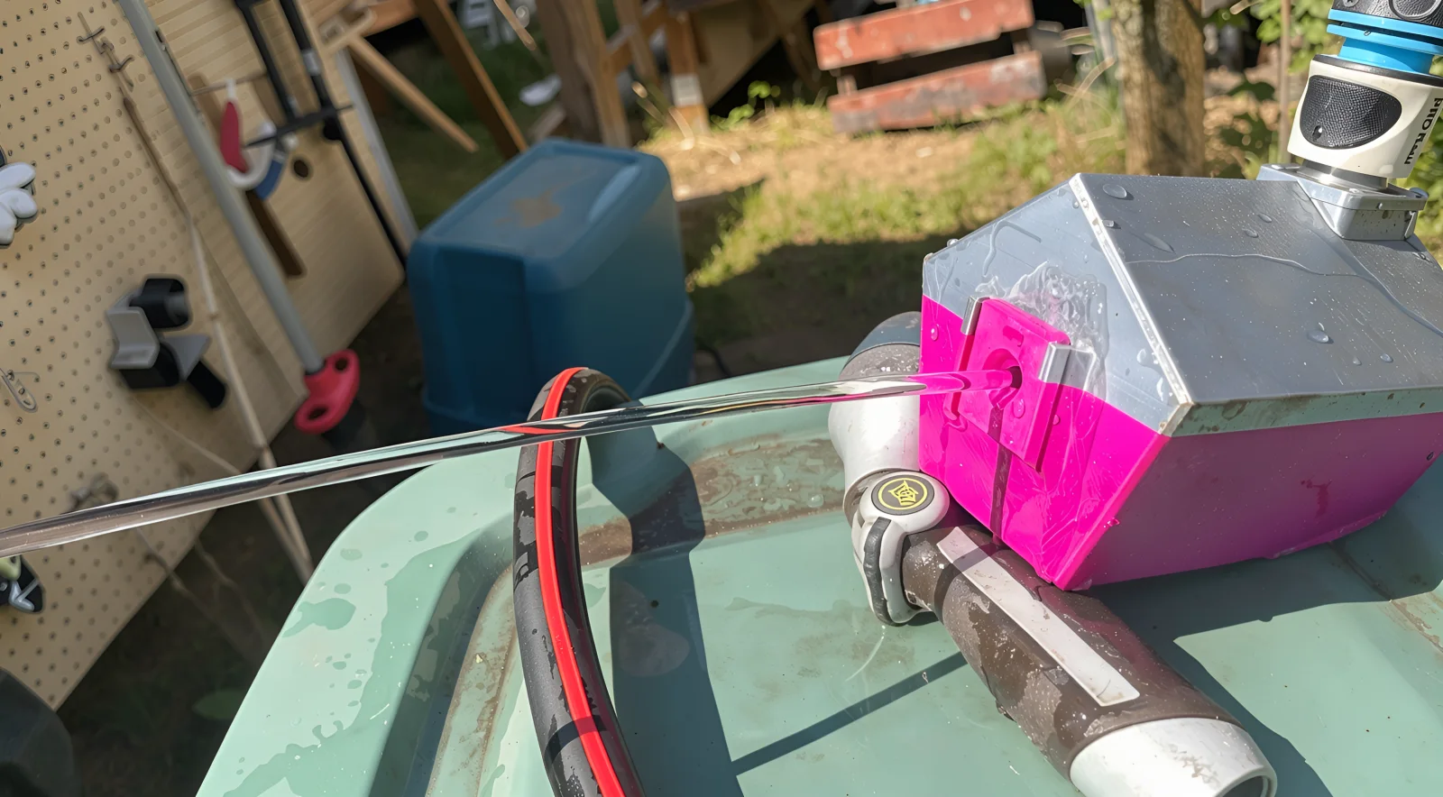 Mk2.2 3D-printed laminar-flow nozzle producing a smooth water stream outdoors.